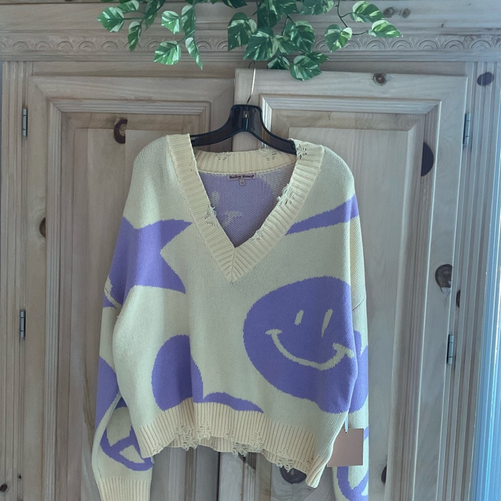 Purple and Cream Women's Smiley Face Sweater $25